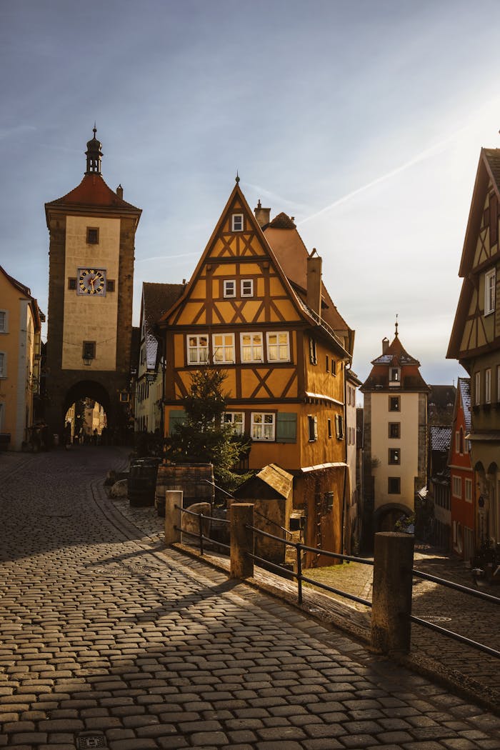 Charming street view of Rothenburg ob der Tauber's iconic half-timbered architecture in Bavaria, Germany.
