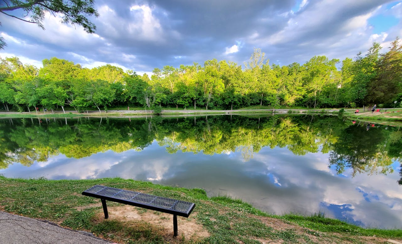 Peaceful reflections on a calm lake at Alexandria Community Park, KY.